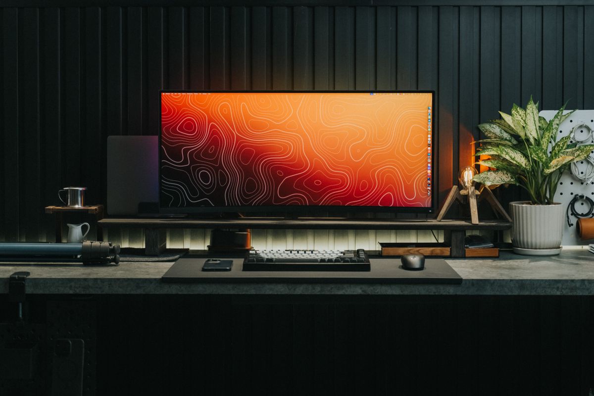 Gaming monitor and keyboard in a tidy desk setup