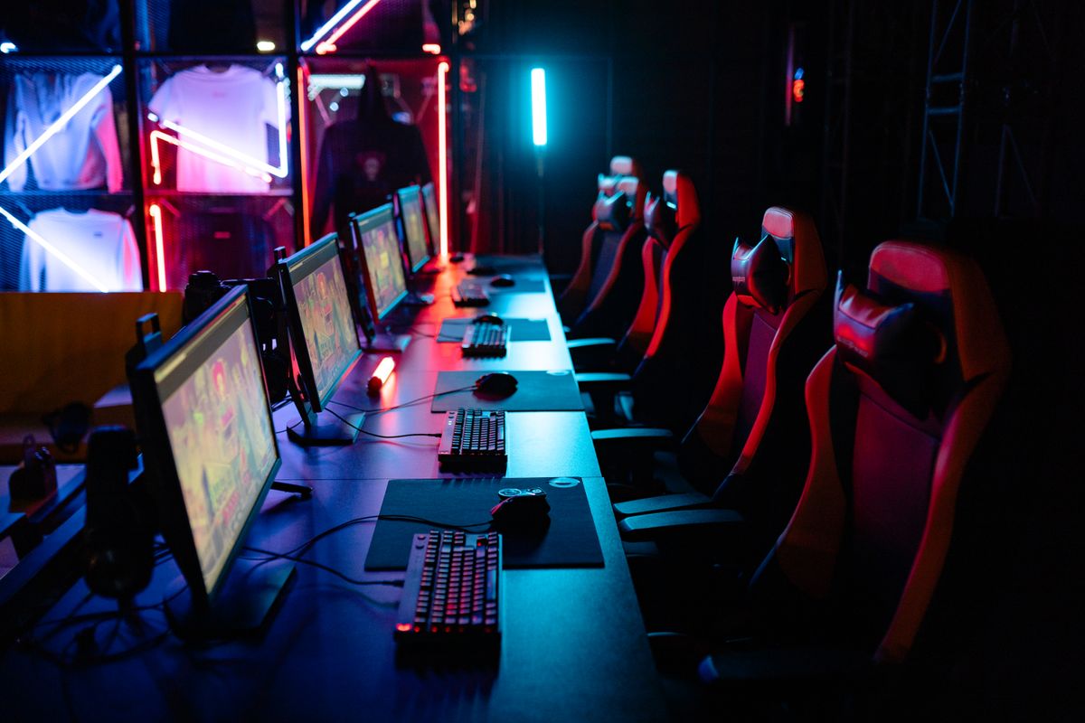PC gaming stations and chairs in an esports room