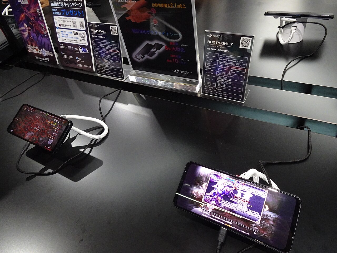 Phones running games on stands at Tokyo Game Show